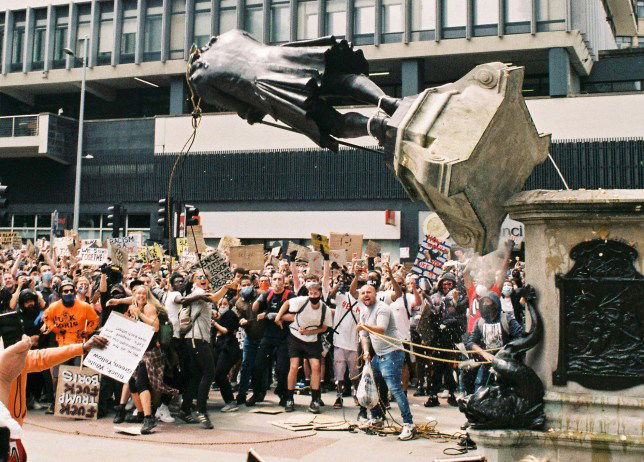 The moment that the statue of Edward Colston was pulled from its plinth (Picture: Harry Pugsley/SWNS)